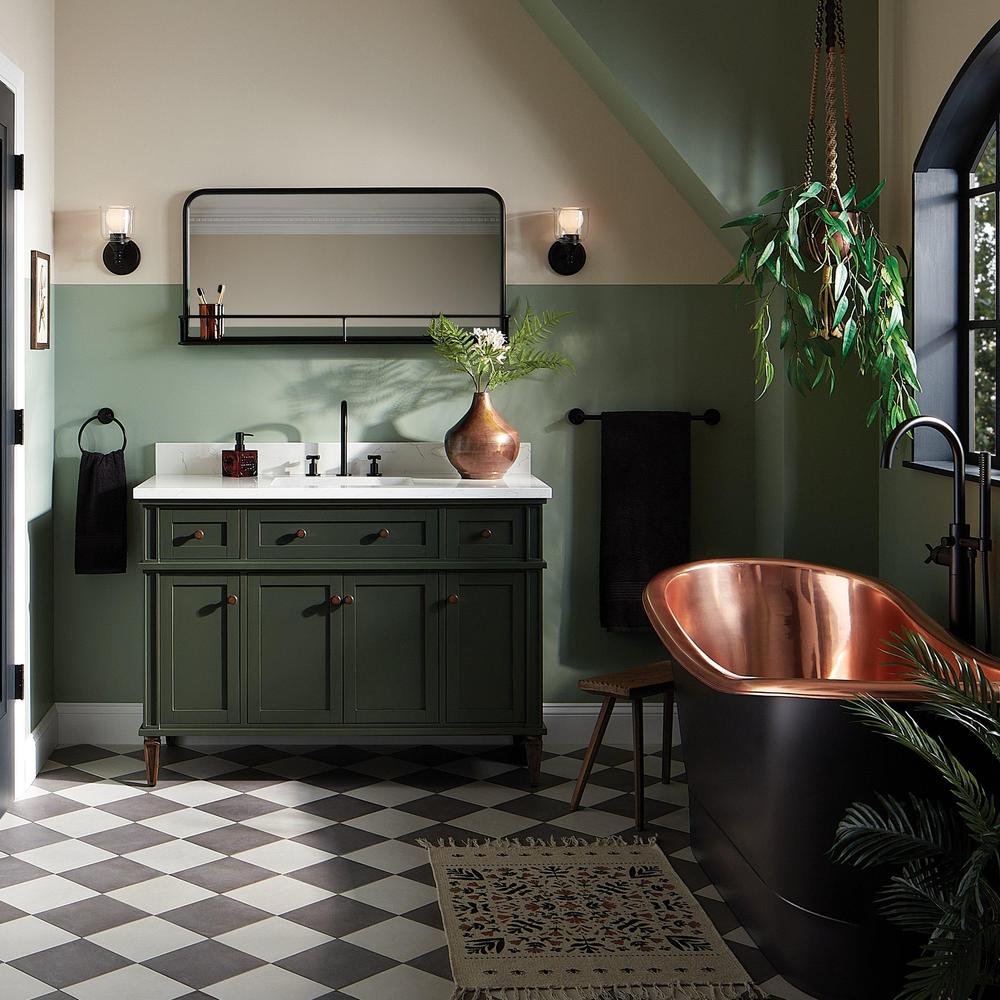 A sophisticated bathroom design featuring olive green cabinets and natural elements.