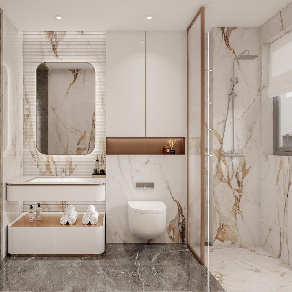 A luxurious bathroom featuring marble walls, sleek vanity, and gold accents.