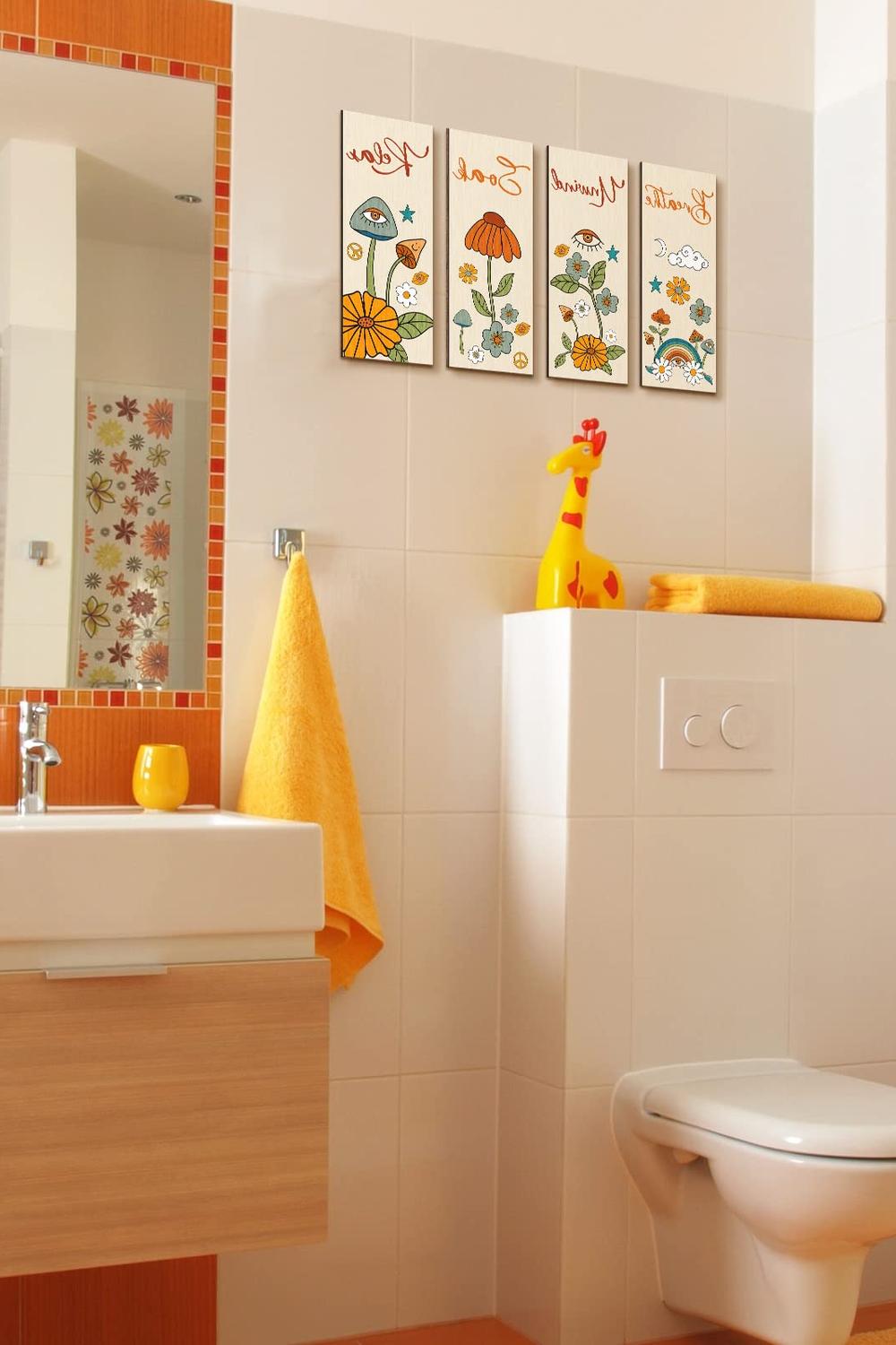 A bathroom with whimsical wall art and playful orange designs for an inviting touch.