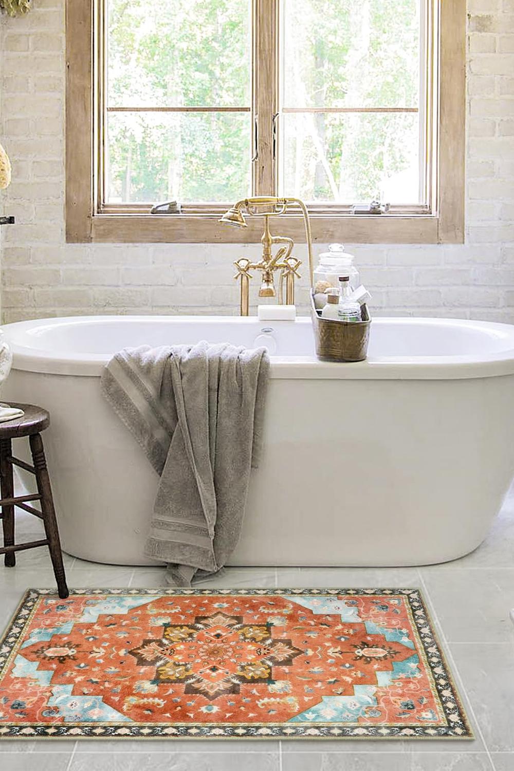 A stylish bathroom featuring a freestanding bathtub and elegant design elements.