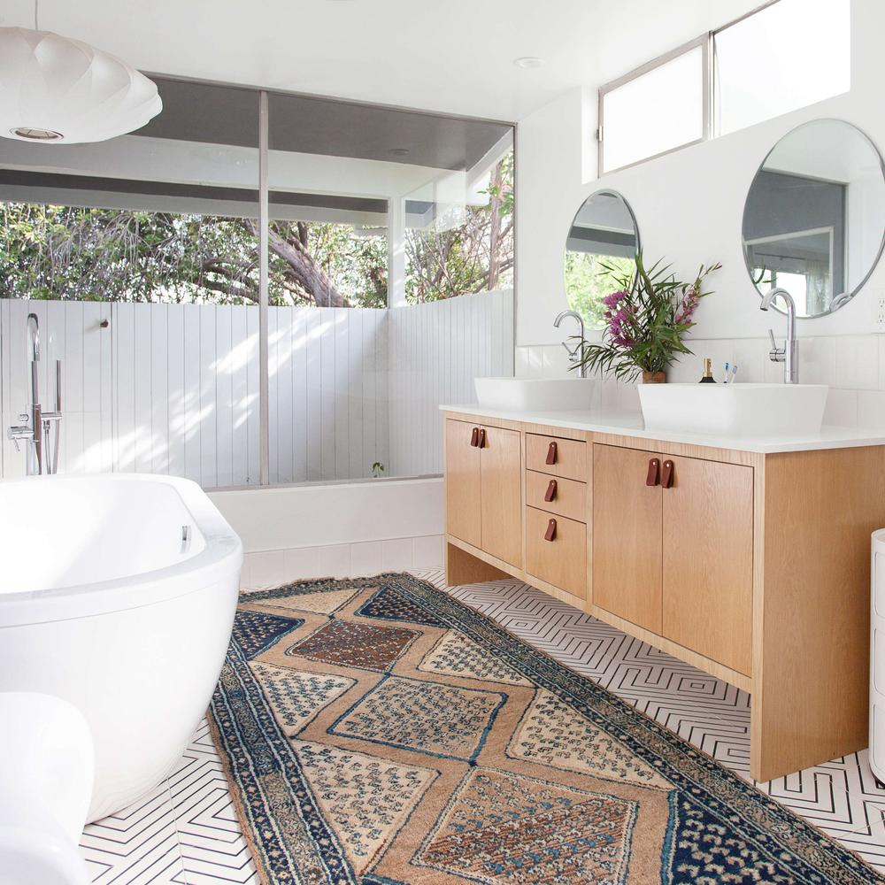 Peaceful sanctuary with light wood and vibrant natural elements in bathroom design