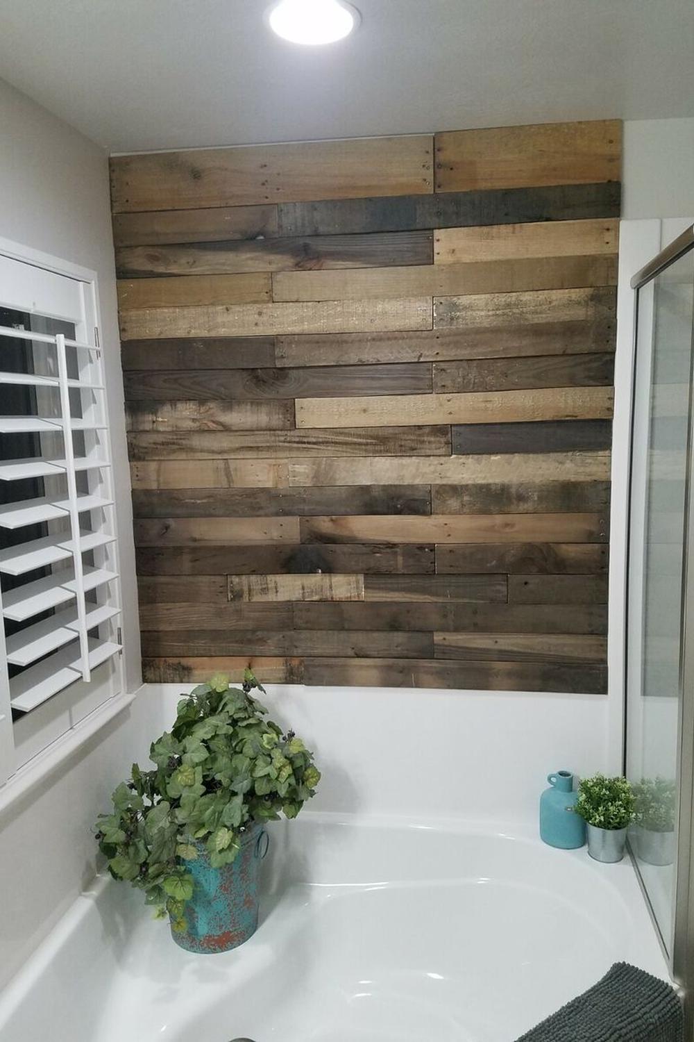 Stylish bathroom with dynamic wooden pallet wall design and natural light features