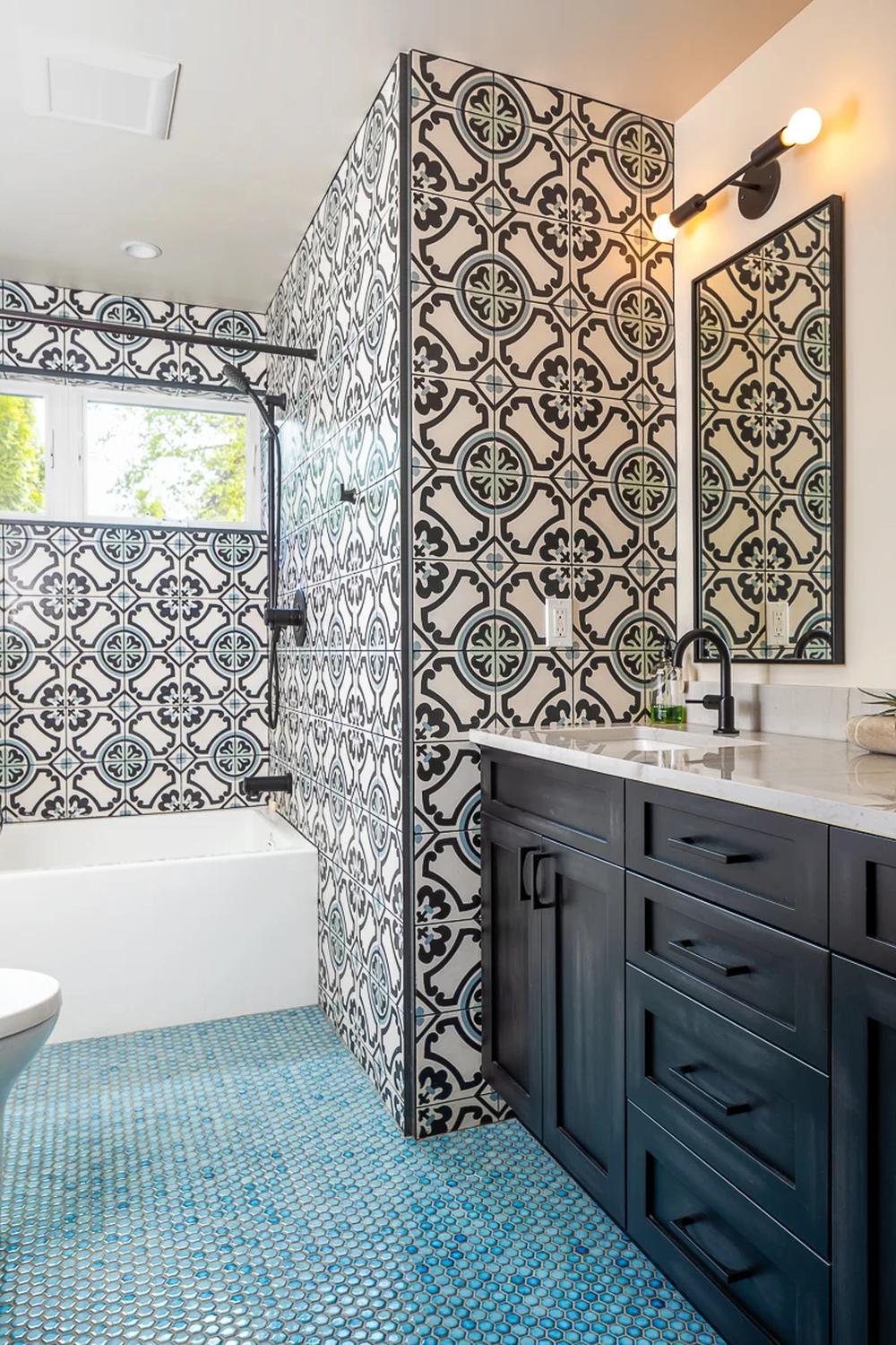 Bold black-and-white geometric patterns with floral accents enhance modern bathroom design.