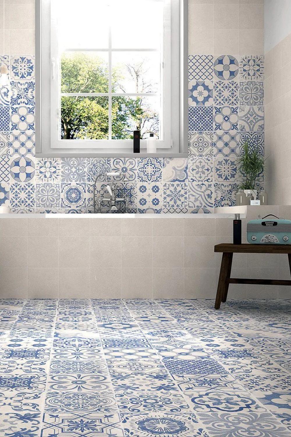 Vibrant blue and white patterned tiles create a lively and inviting bathroom atmosphere.