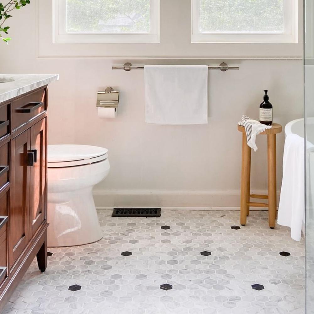Honeycomb pattern flooring combined with modern bathroom elements.
