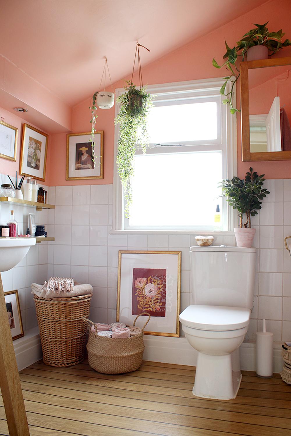 Charming bathroom with peach accents and organic decor