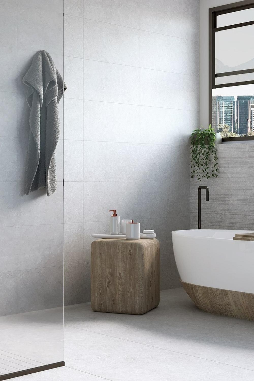 Baño esculpido con tonalidades suaves y funcionalidad única, creando un refugio moderno