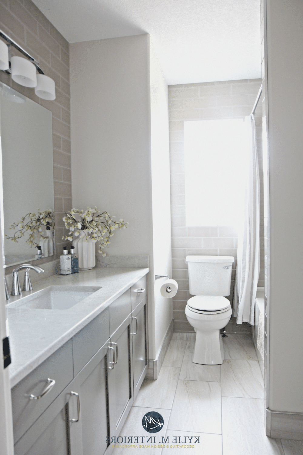 Seamlessly integrated bathroom design featuring modern fixtures in a pearl gray palette