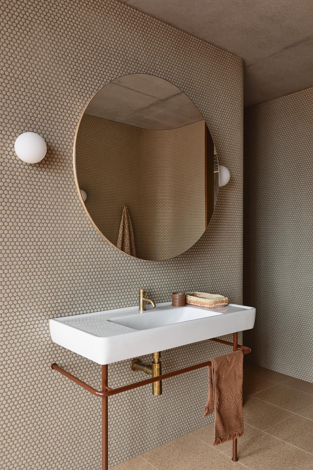 A refined bathroom featuring thoughtful material choices for a stylish design.