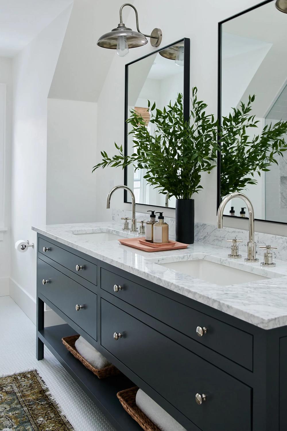 A modern bathroom featuring a balance of color and pattern variety in its design.