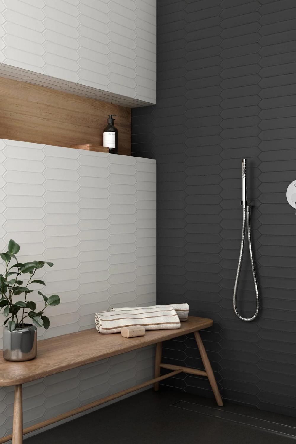 Stylish modern bathroom featuring textured picket tiles in neutral tones, creating a sophisticated and inviting space.