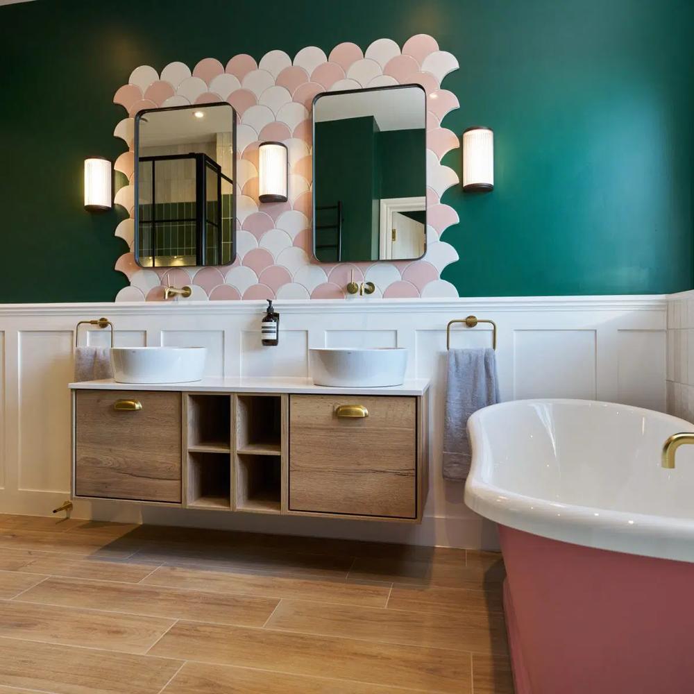 Vintage-inspired bathroom with pink and green tile accents