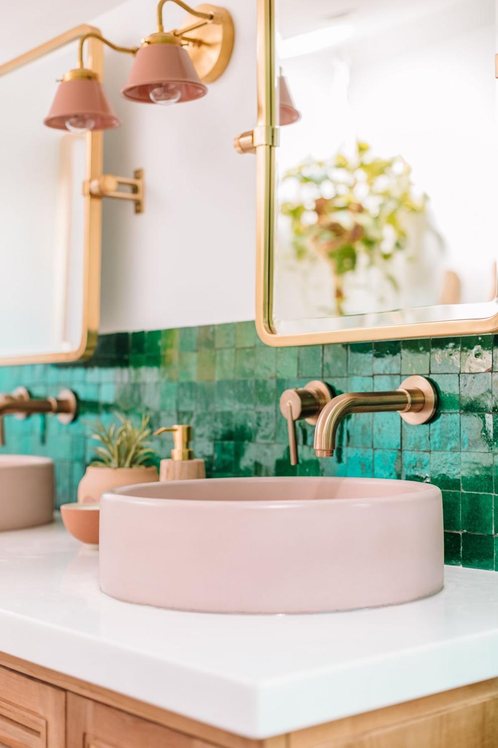 Modern bathroom showcasing soft pink and rich green color palette