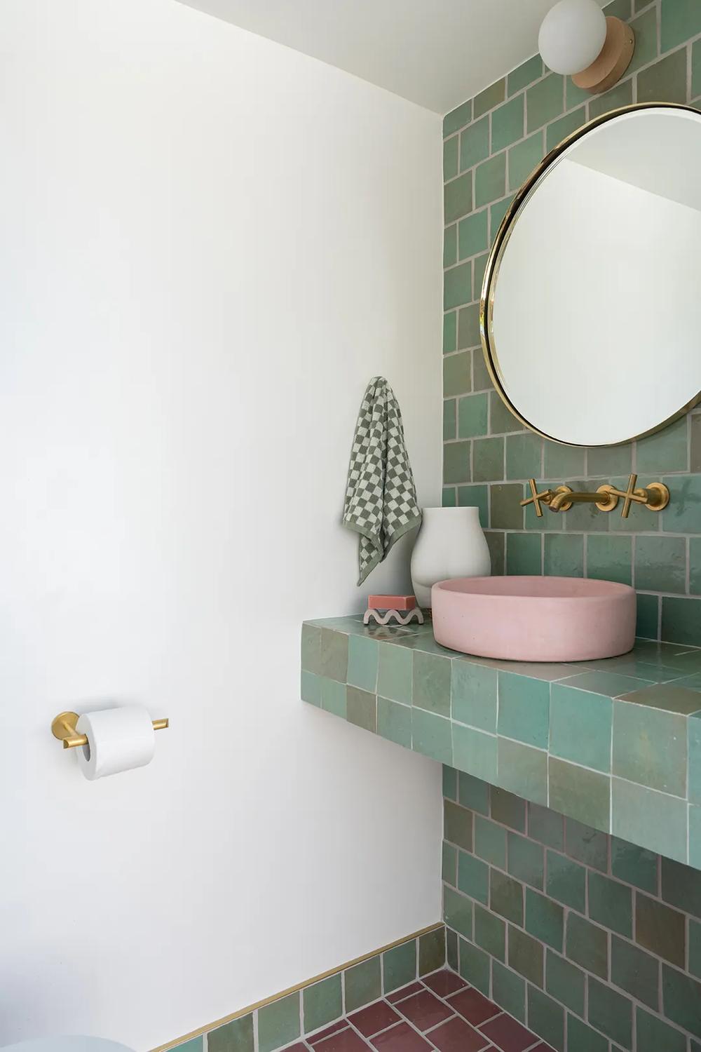 Stylish bathroom with muted and vibrant pink and green colors