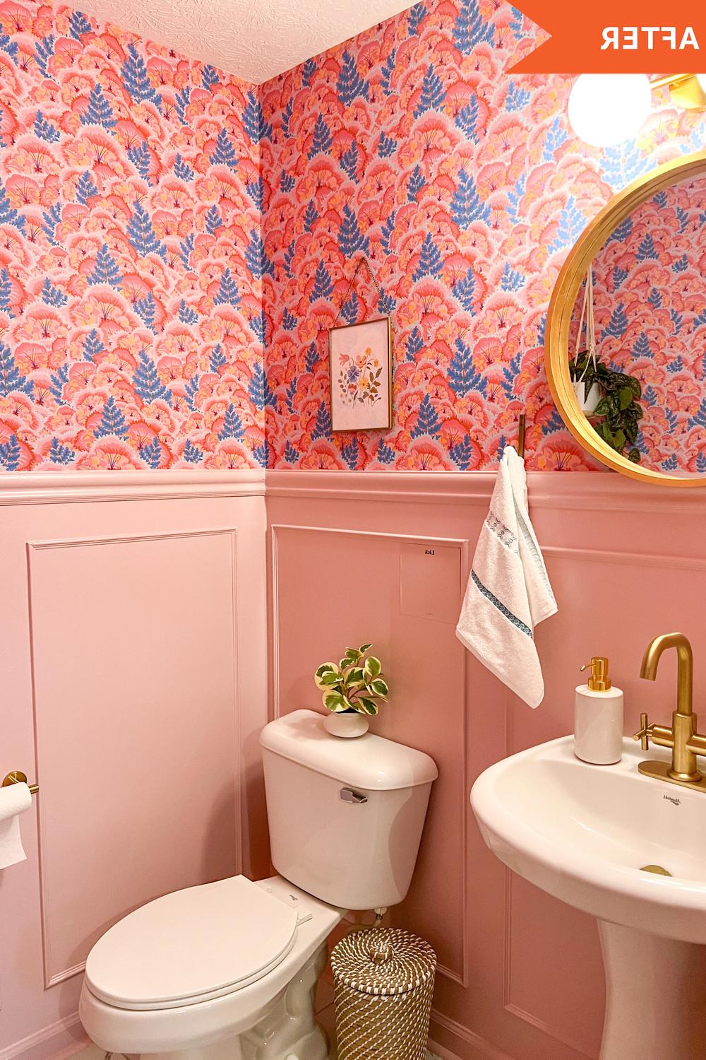 Vibrant pink bathroom featuring bold floral wallpaper and modern white fixtures