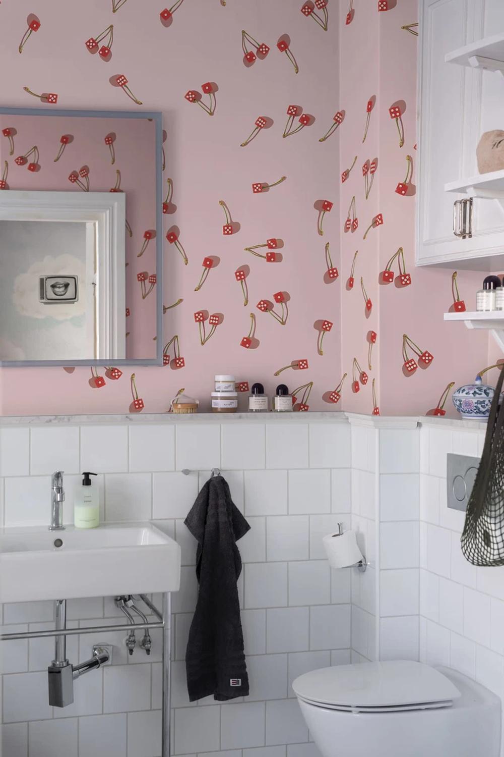 Stylish bathroom featuring cherry motif wallpaper and modern fixtures