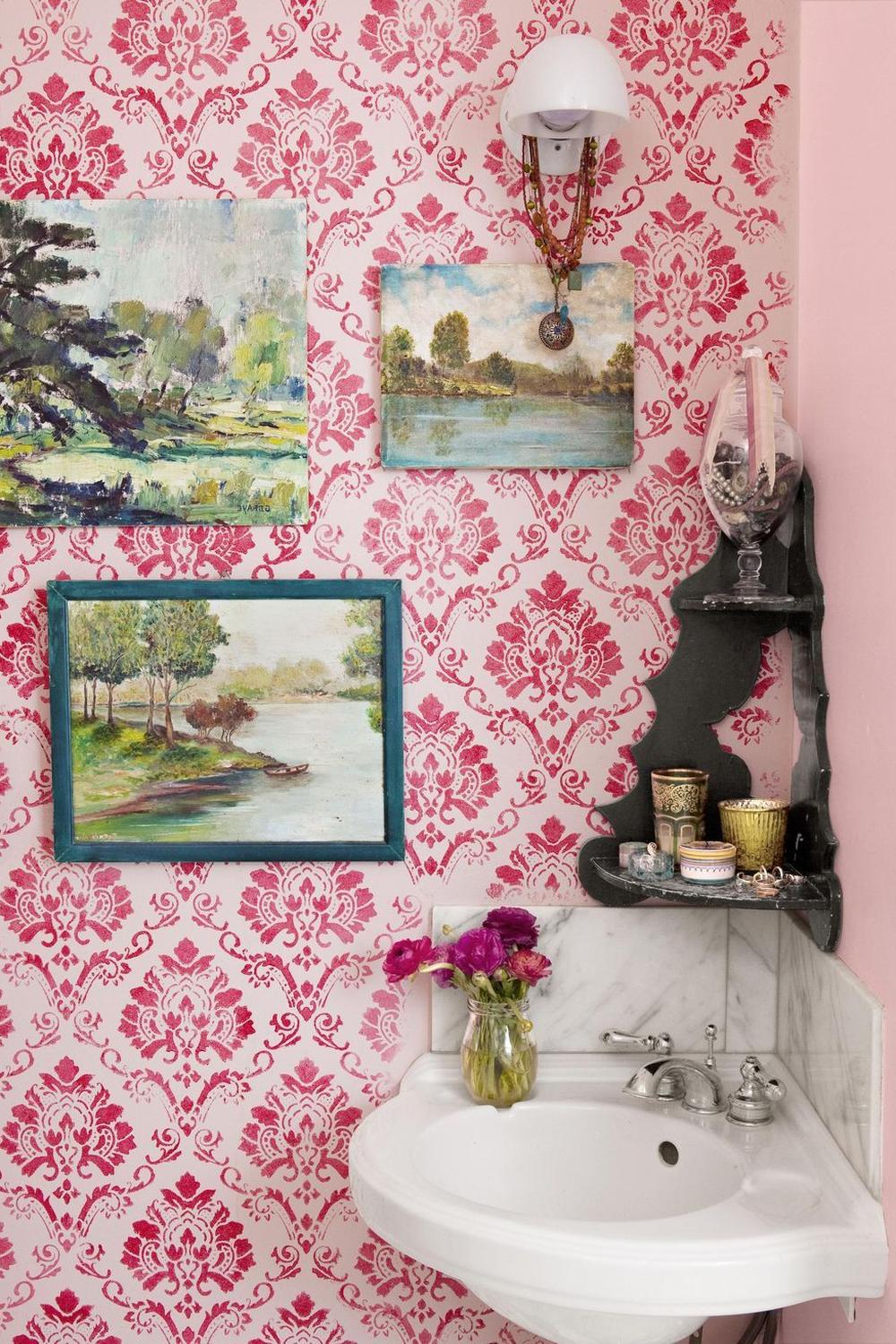 Charming rustic bathroom with playful accents and floral wallpapers.