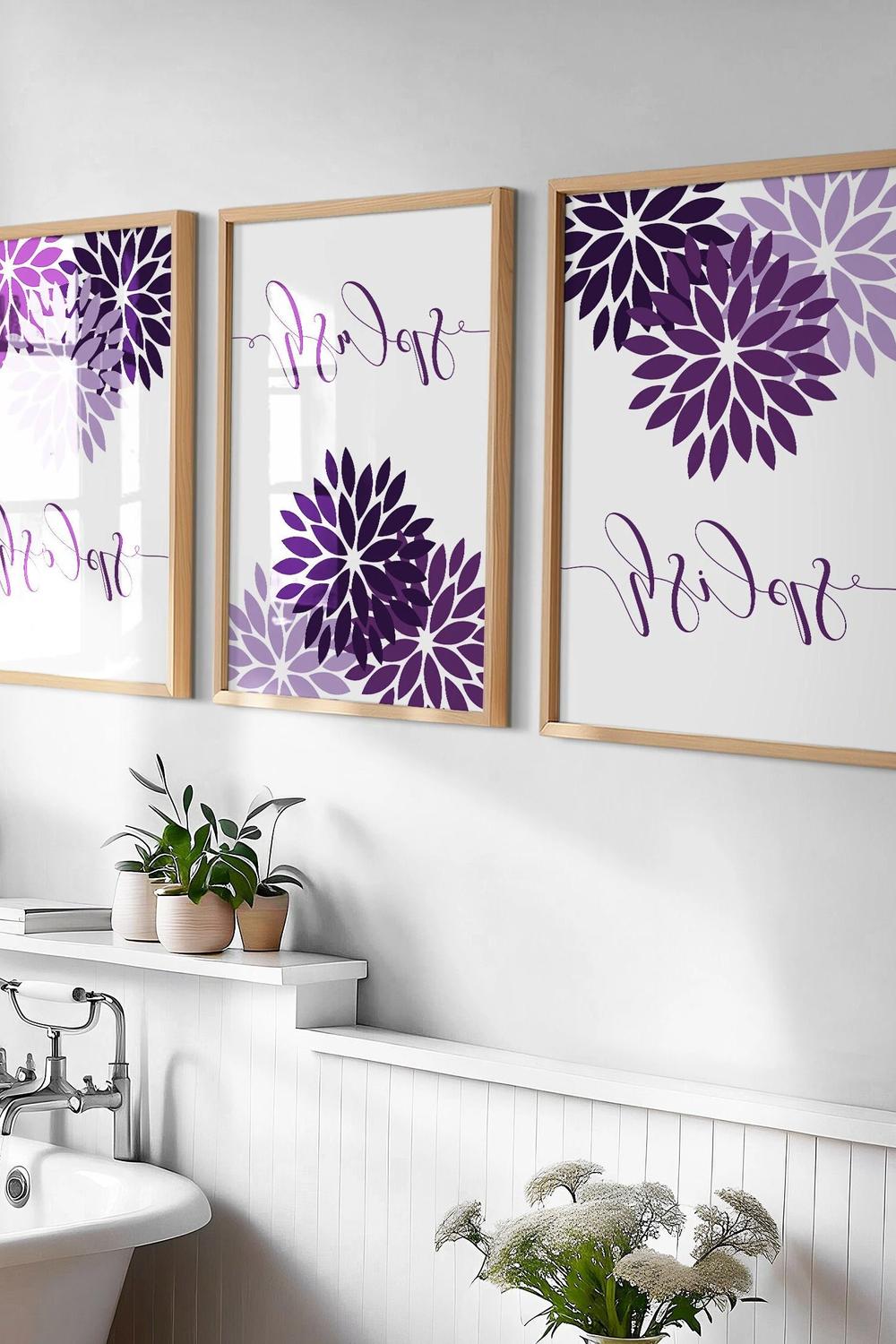 A charming bathroom featuring art prints and plant accents.
