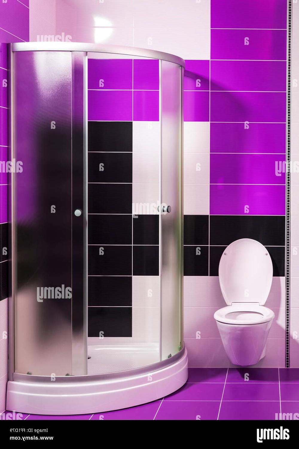 Bathroom designed with glossy purple and black tiles and modern fixtures.
