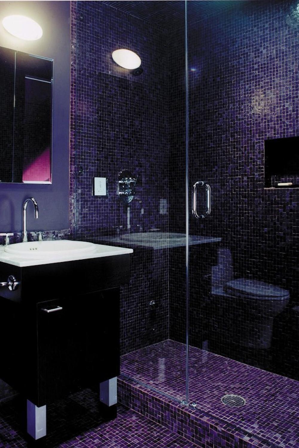Modern bathroom with seamless purple tiling and sleek fixtures