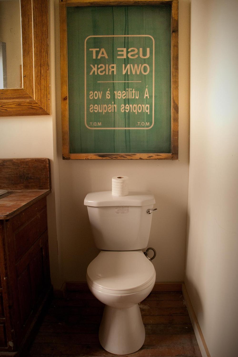 Rustic bathroom design with humor and clean lines