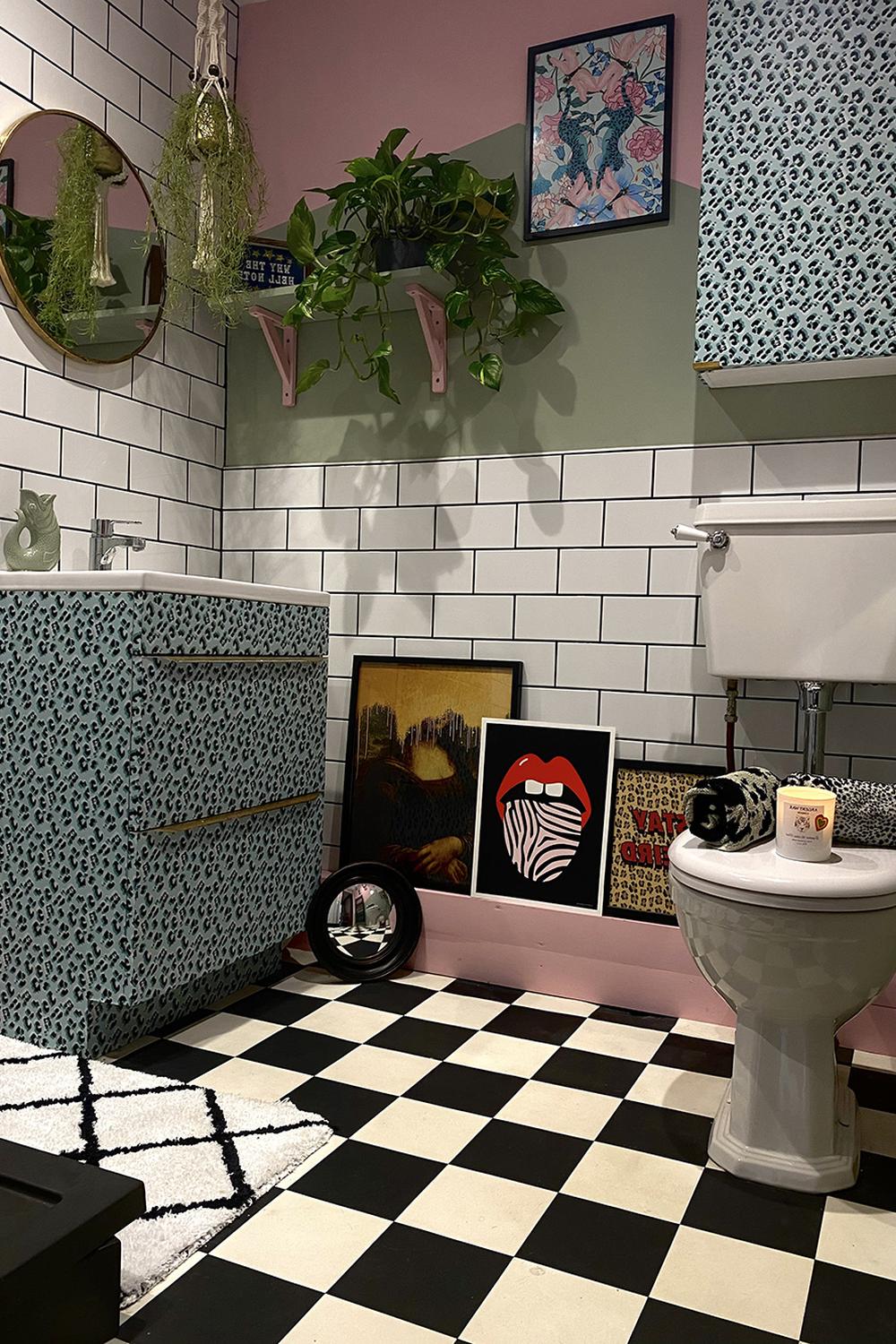 Bathroom design featuring pinks and greens in a playful layout