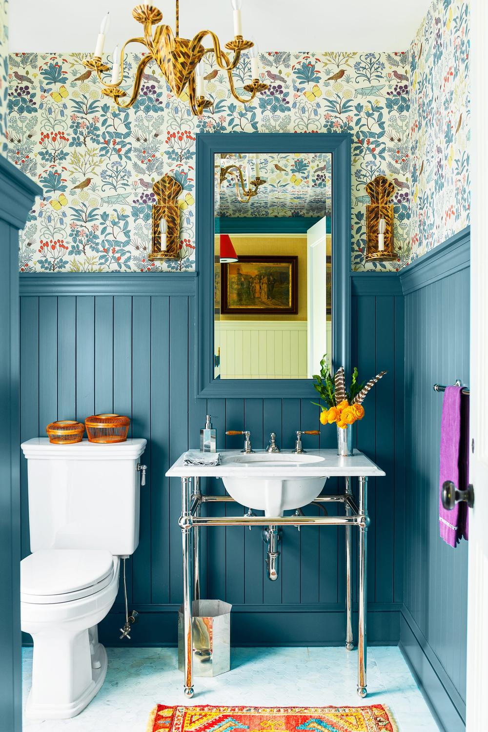 Blend of modern and vintage bathroom design with playful wallpaper