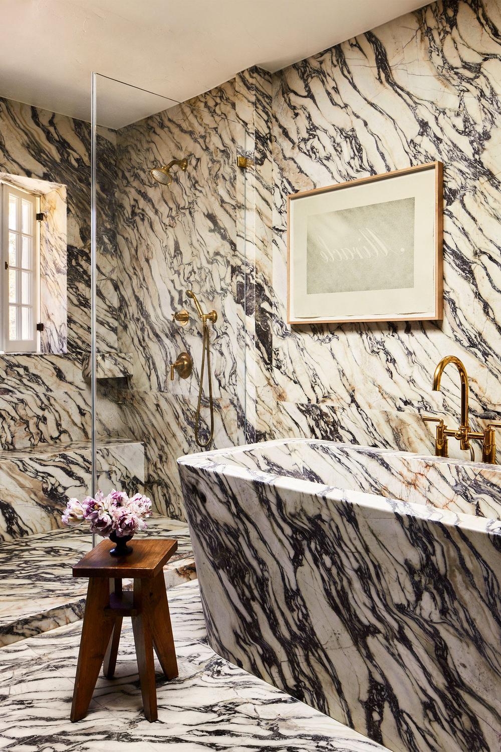 Luxurious bathroom with bold marble and playful accents