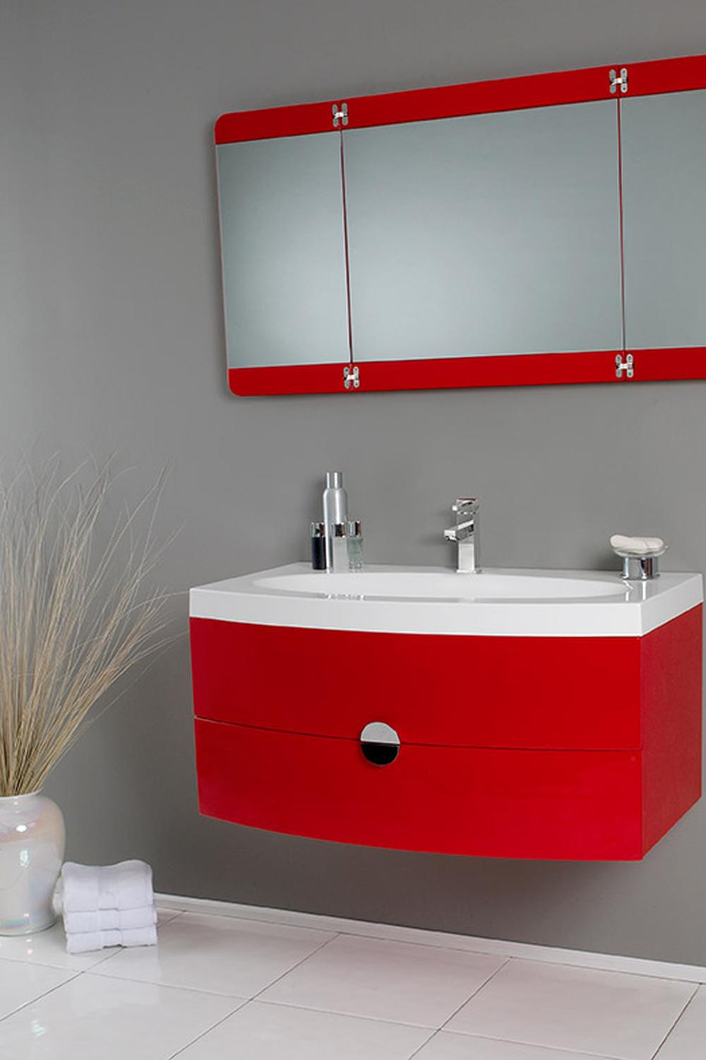 A modern red vanity set with a sleek design and gray wall contrast.
