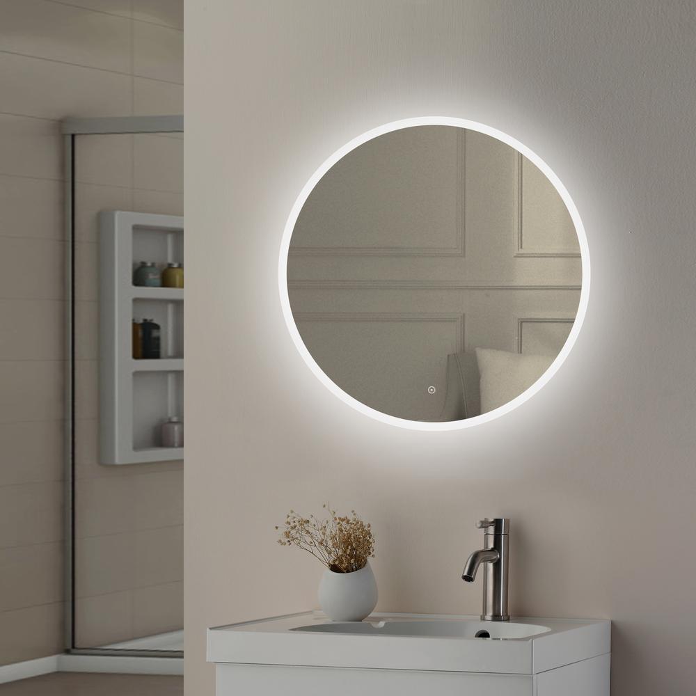 Bold round mirror forming a statement piece in a contemporary bathroom.