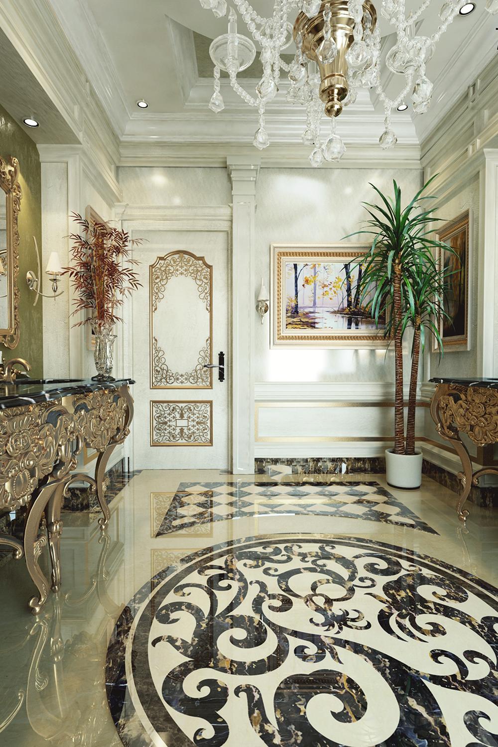 Opulent entryway featuring a large crystal chandelier and intricate wall treatment