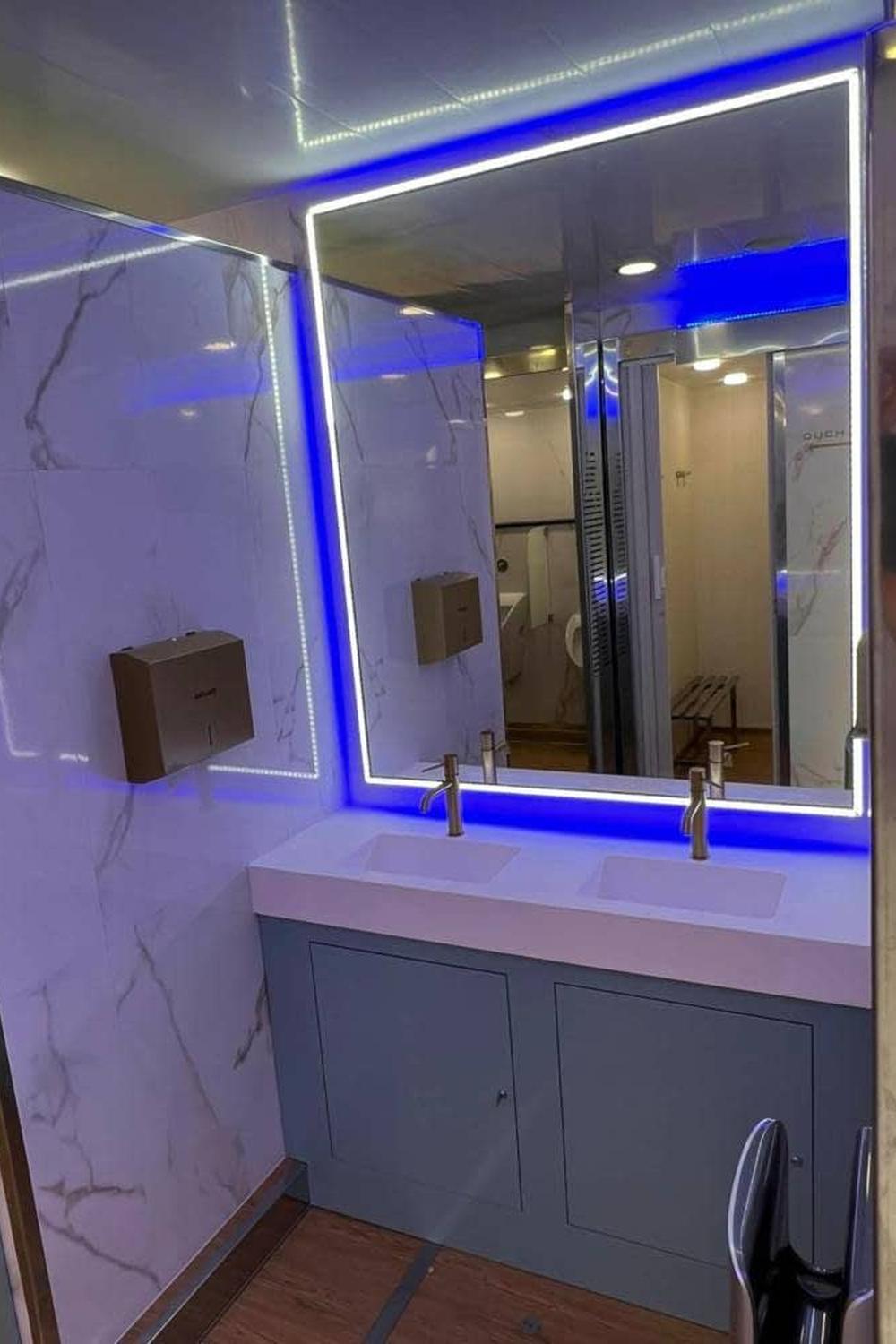 Stylish contemporary bathroom exhibiting luxurious features