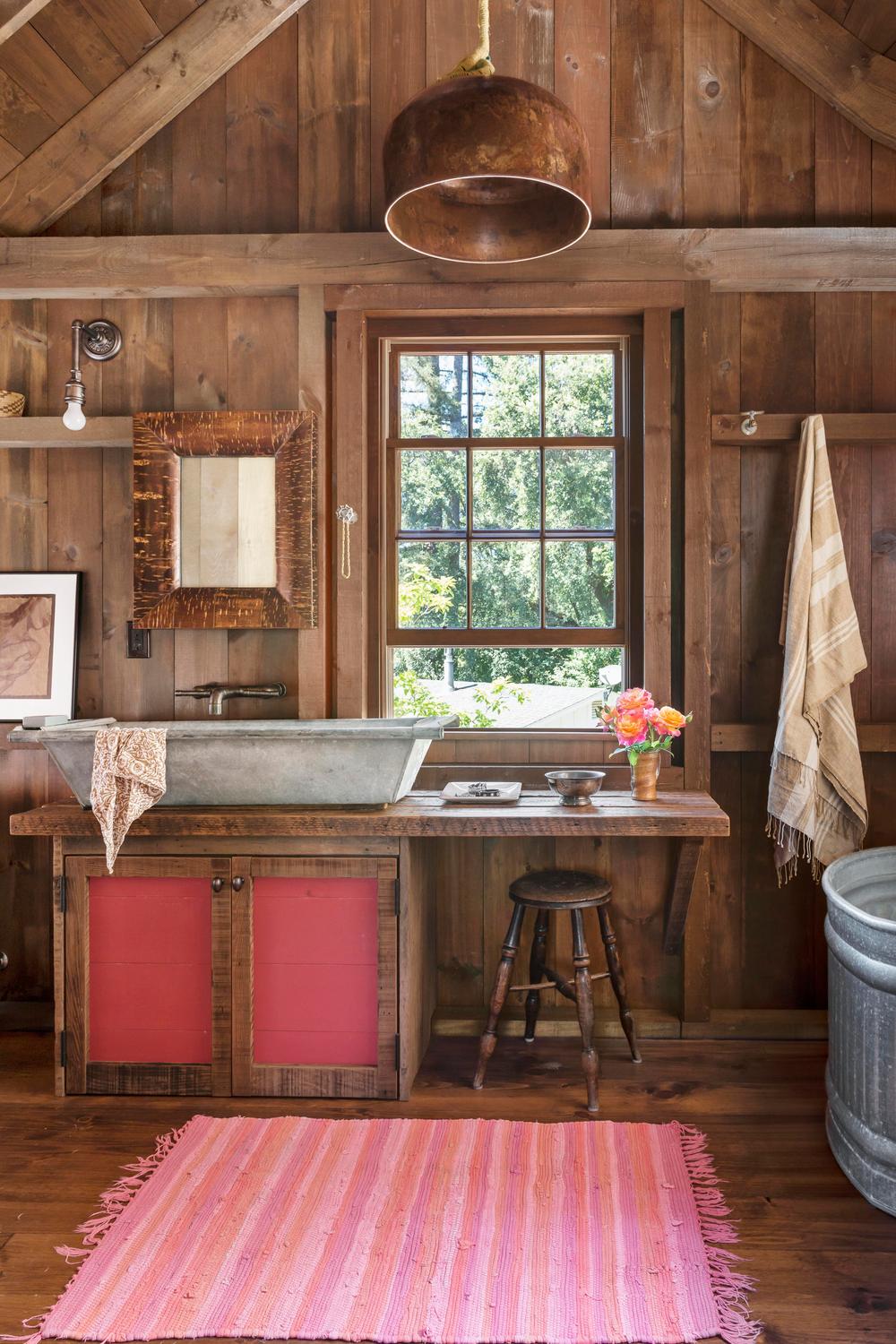 Rustic bathroom design focusing on deeper shades for dynamic yet comfortable aesthetics.
