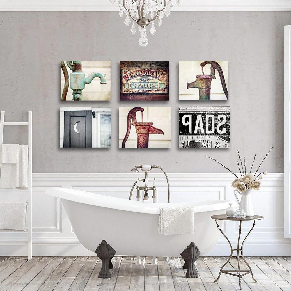 Charming rustic bathroom with a freestanding bathtub and vintage decorations.