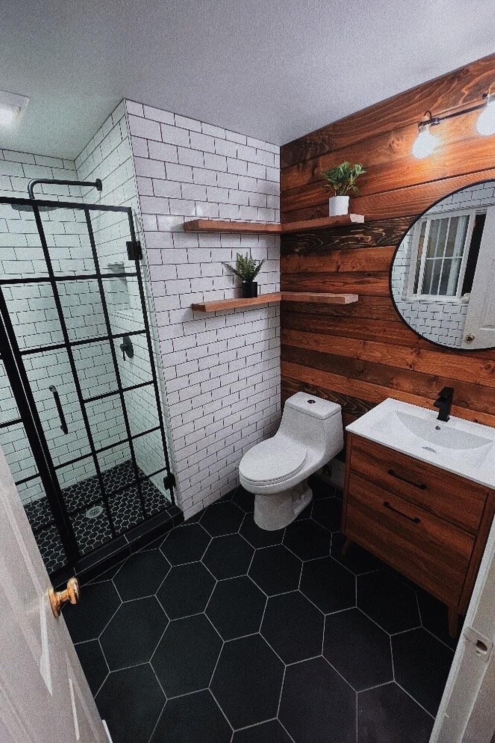 Contemporary rustic industrial bathroom with contrasting accents of light and dark.