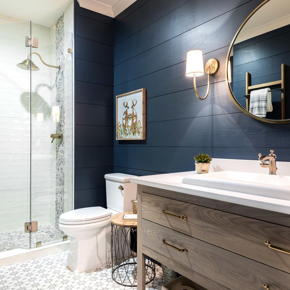 Bold navy blue rustic industrial bathroom featuring stylish design elements.
