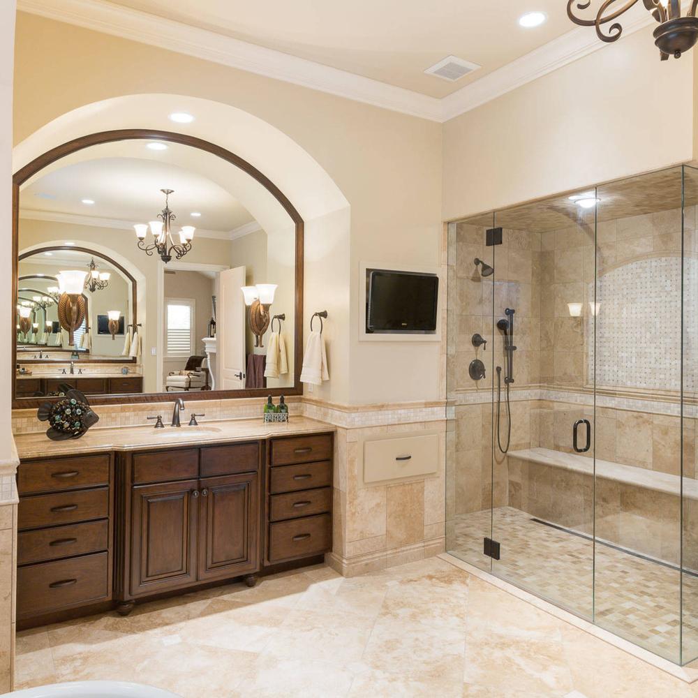 A beautiful rustic travertine bathroom with a warm color palette and elegant design elements.
