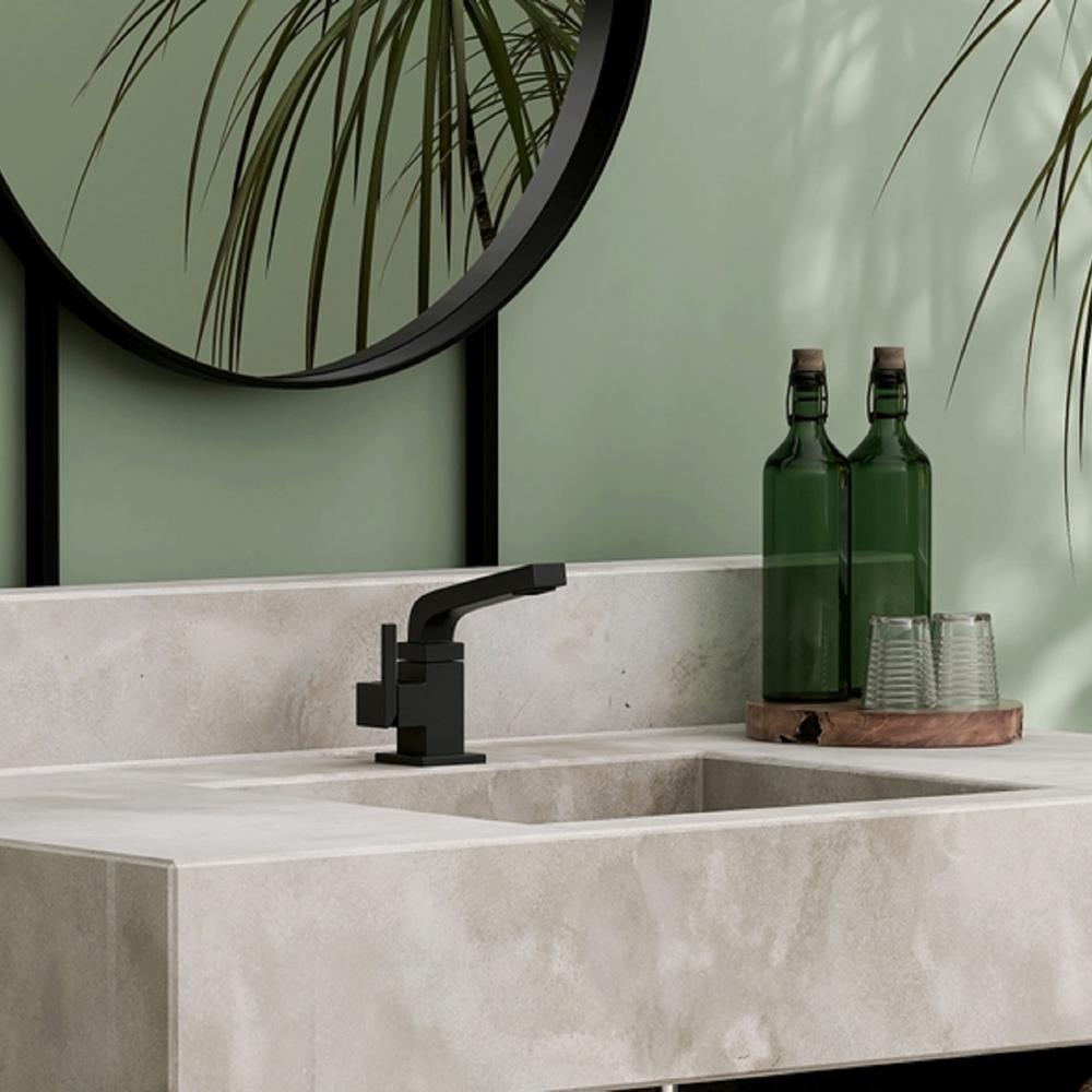 Minimalist bathroom with sage green elements and functional décor.