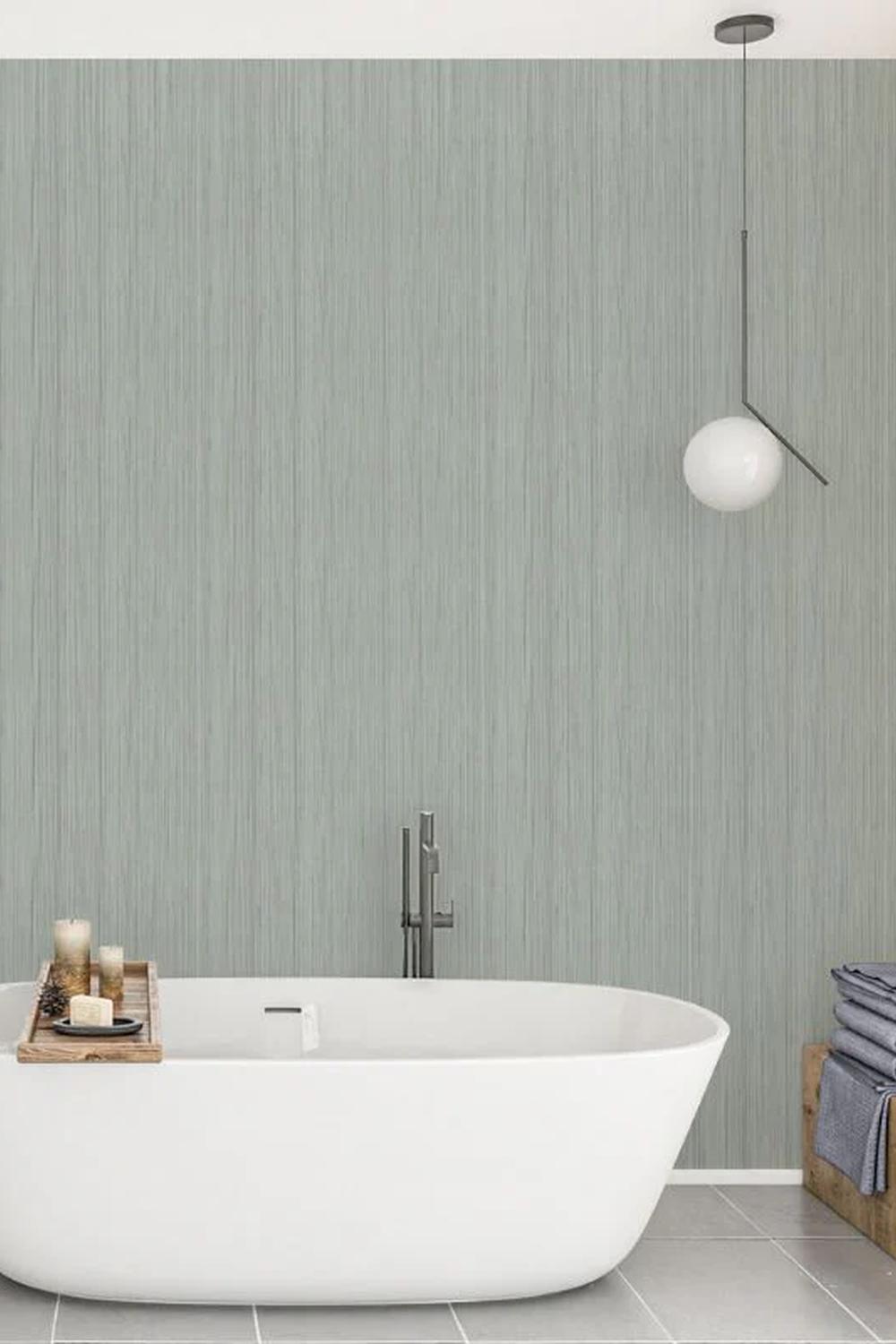 Stylish bathroom featuring a centralized freestanding tub and elegant design elements.