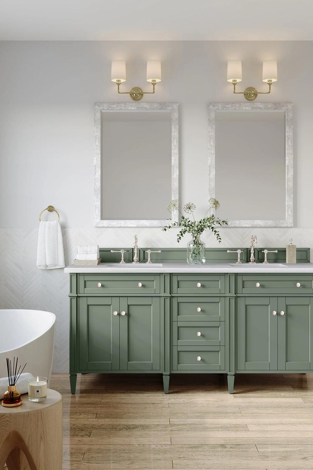 A spacious sage green vanity with a traditional design and ample storage, showcased in a modern bathroom.