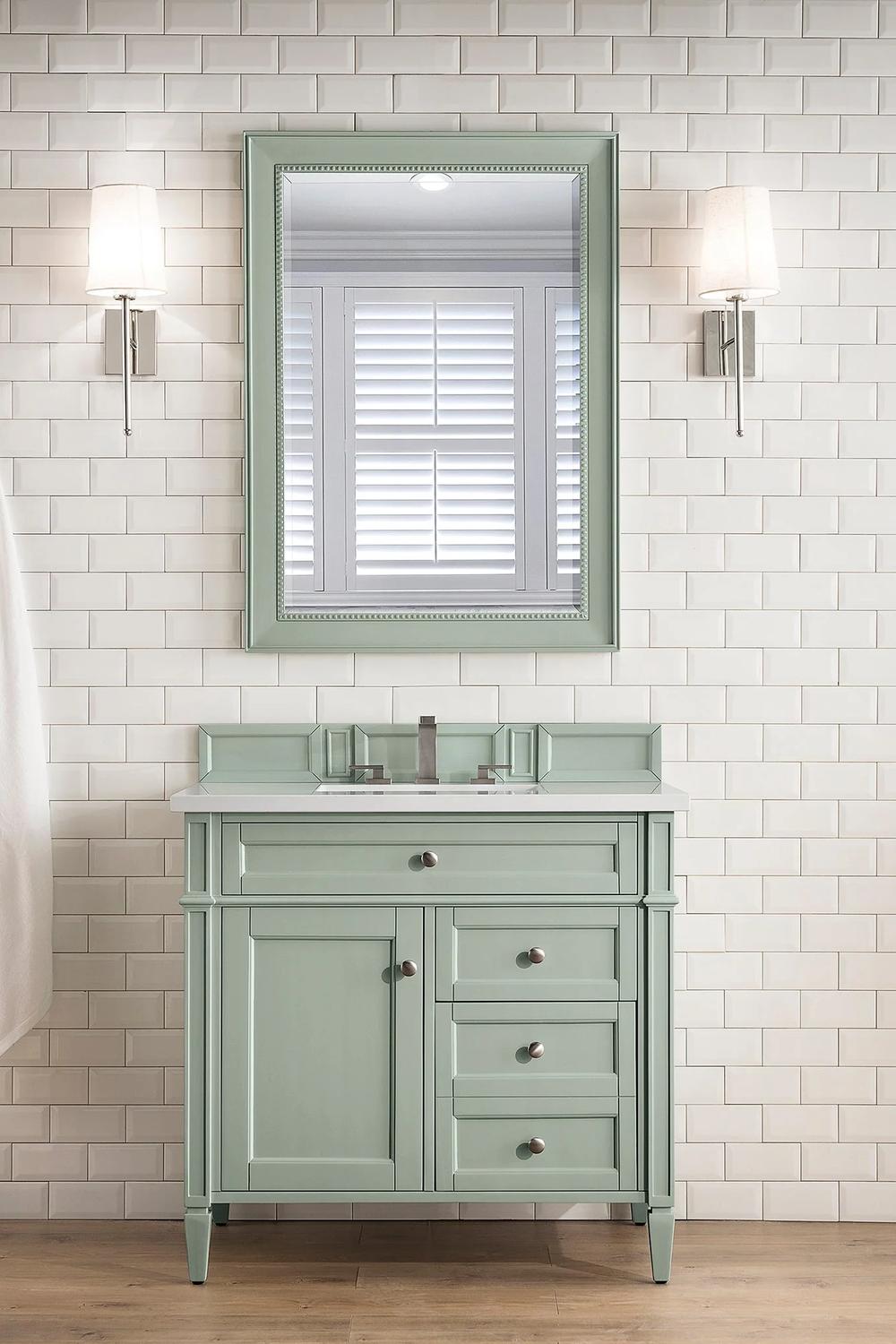 Luxe sage green dual sink vanity with finely textured mirror adding sophistication.