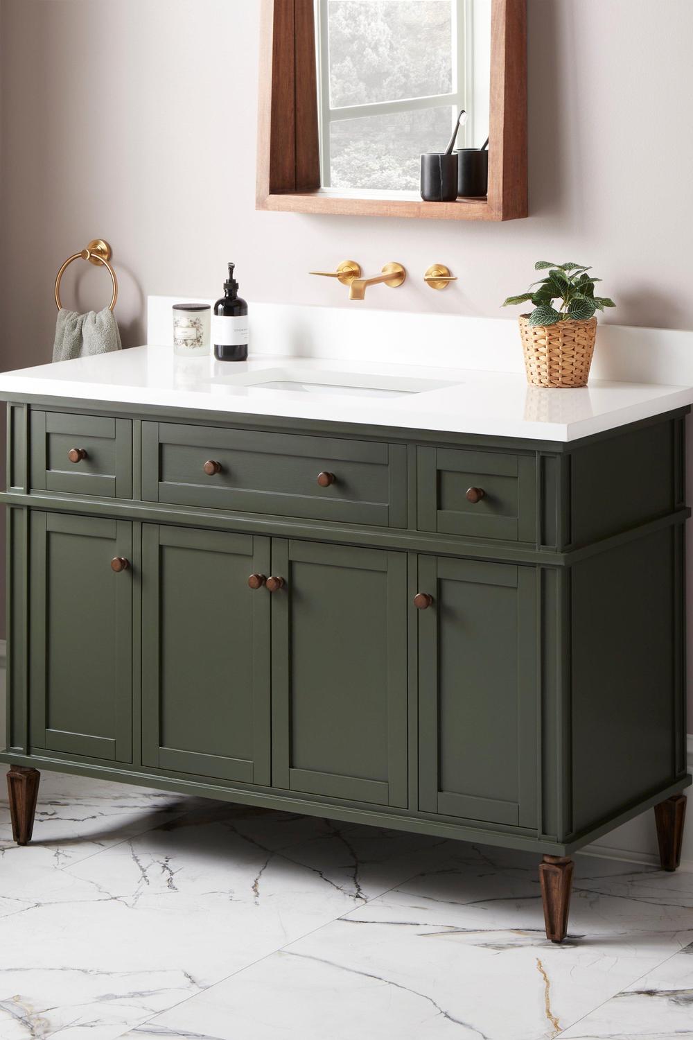 Eclectic sage green vanity with tasteful design and practical features for delightful ambiance.
