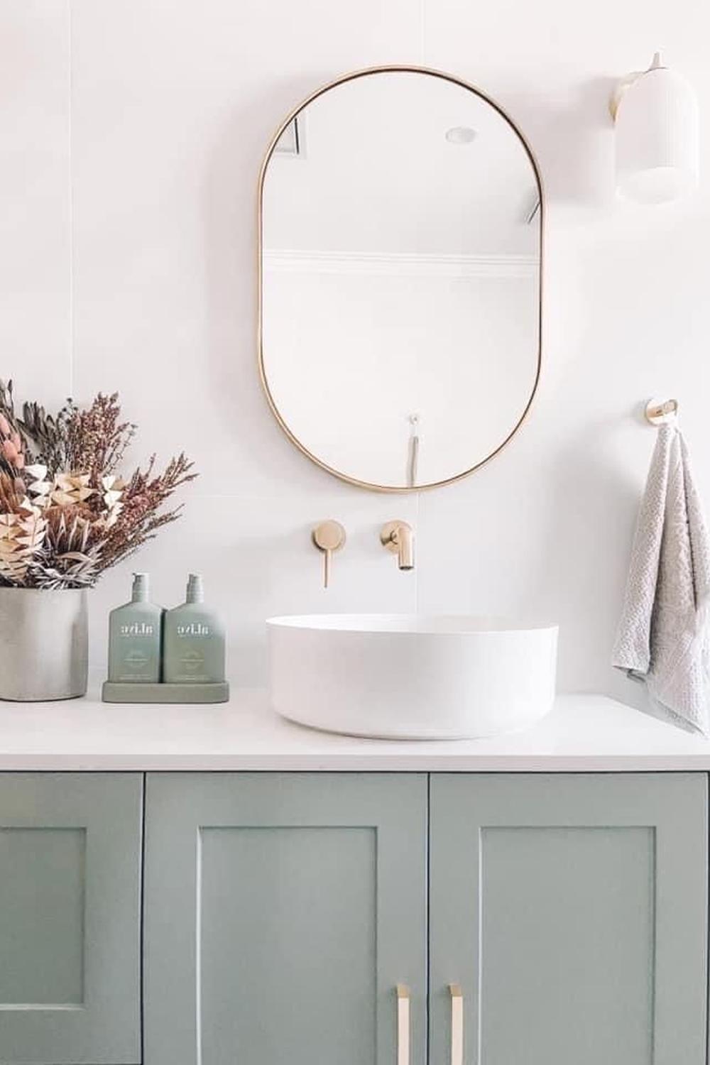 Sage green vanity featuring botanical patterns, creating a fresh and colorful bathroom space.