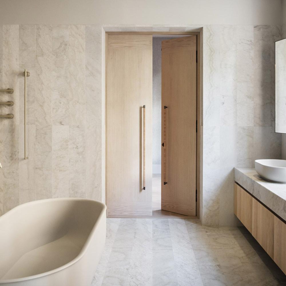 Baño escandinavo moderno con azulejos de mármol y bañera beige moderna