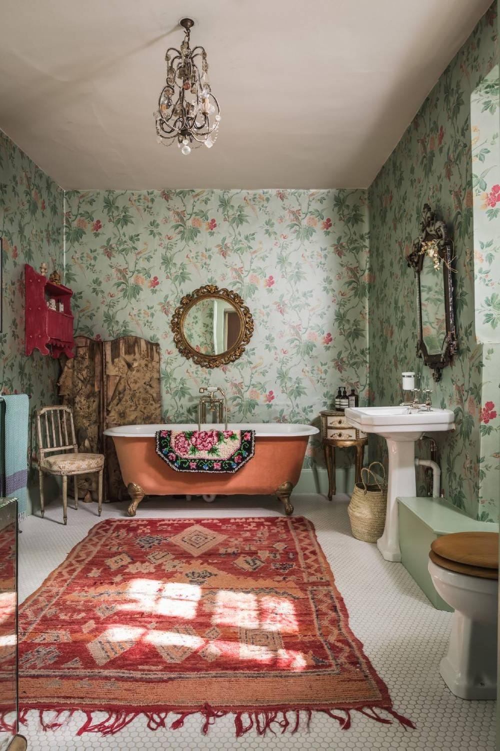 Floral wallpaper in a cute shabby chic bathroom