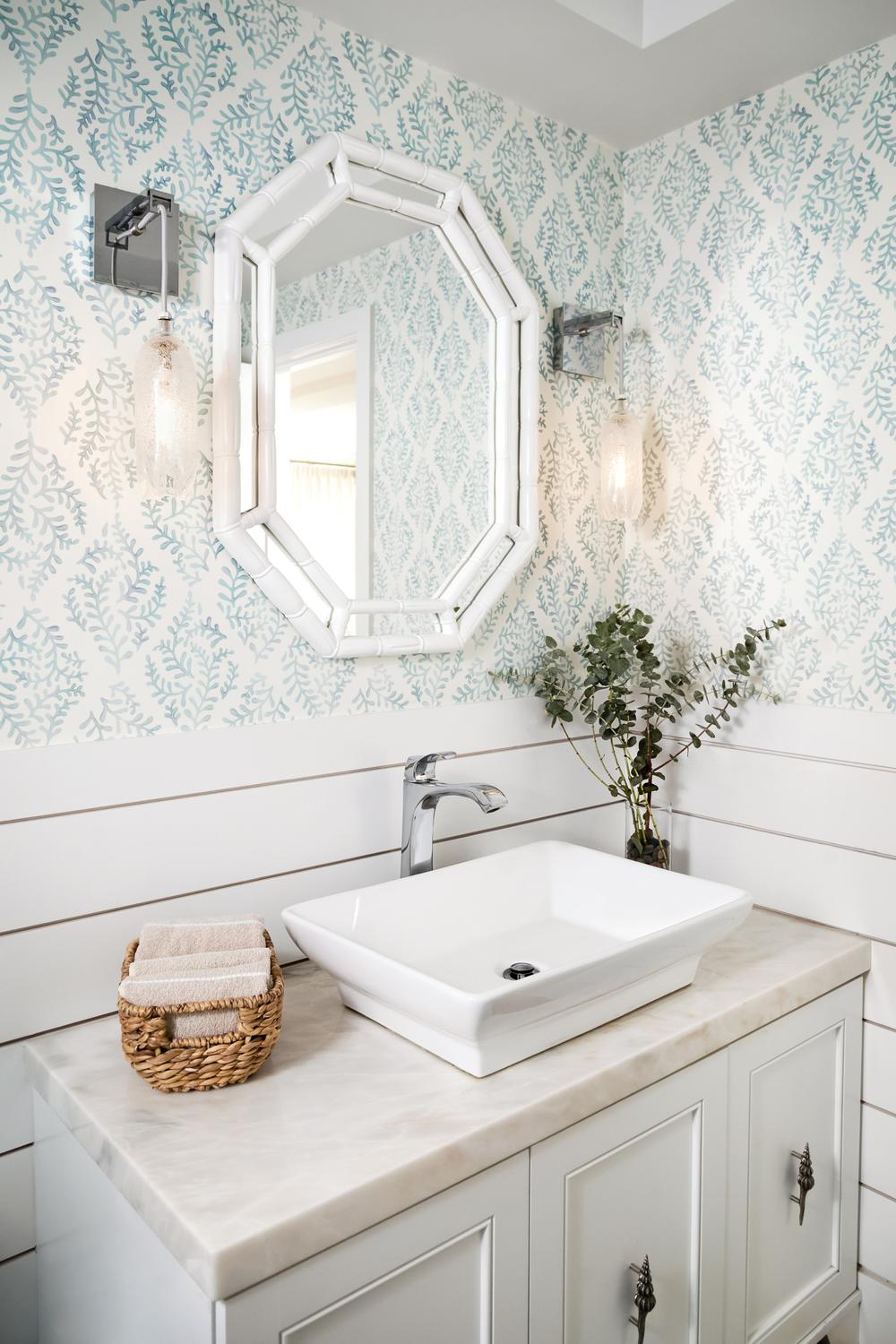 Bathroom design featuring light blue damask wallpaper and white shiplap