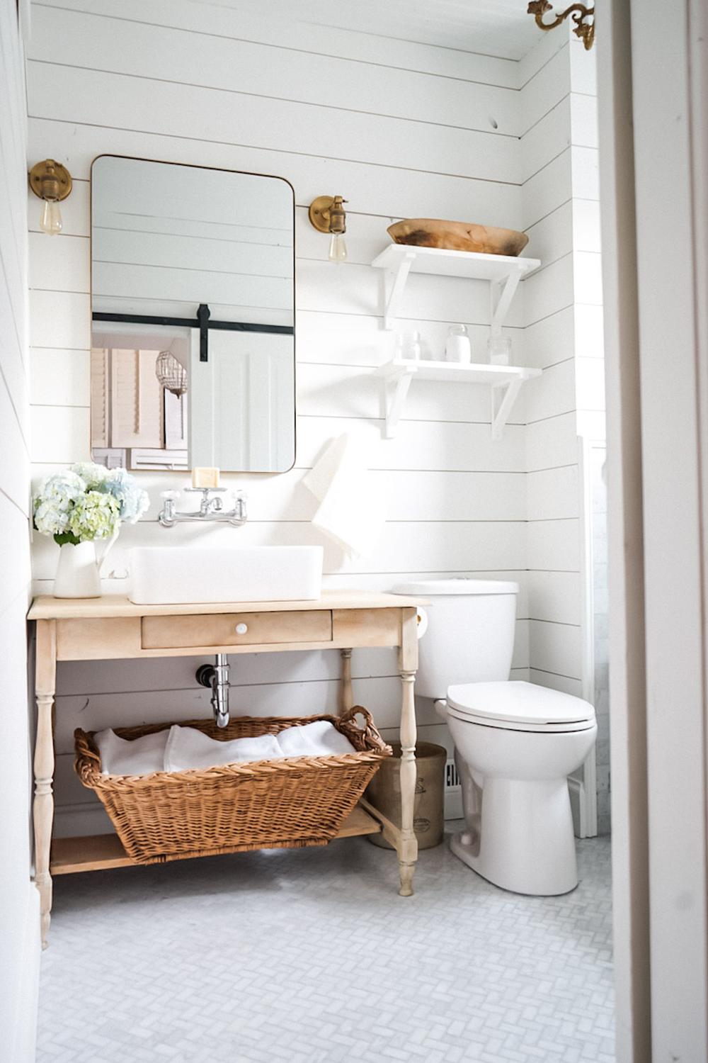 Stylish bathroom showcasing light shiplap and minimalist design decor