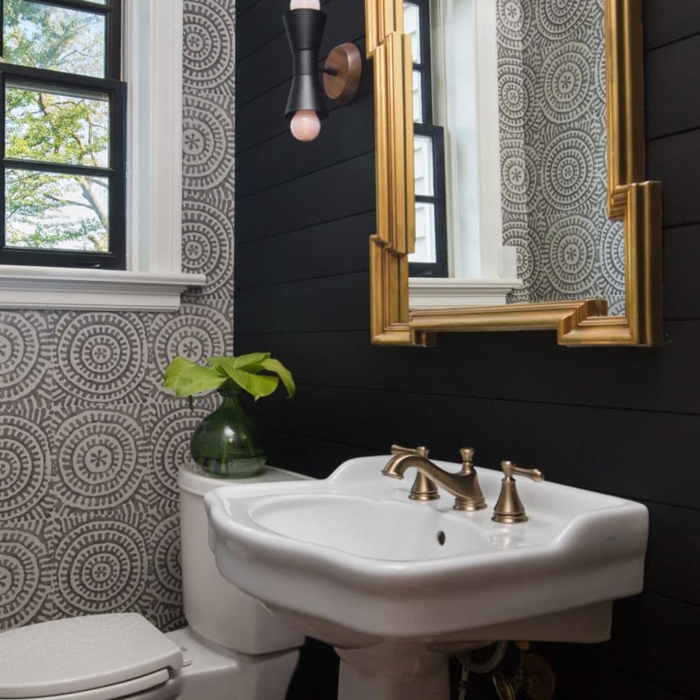 Bright bathroom with natural light, shiplap, and floral motifs