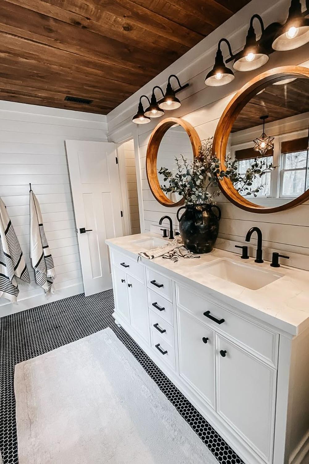 Bathroom featuring a double vanity with shiplap walls and elegant fixtures
