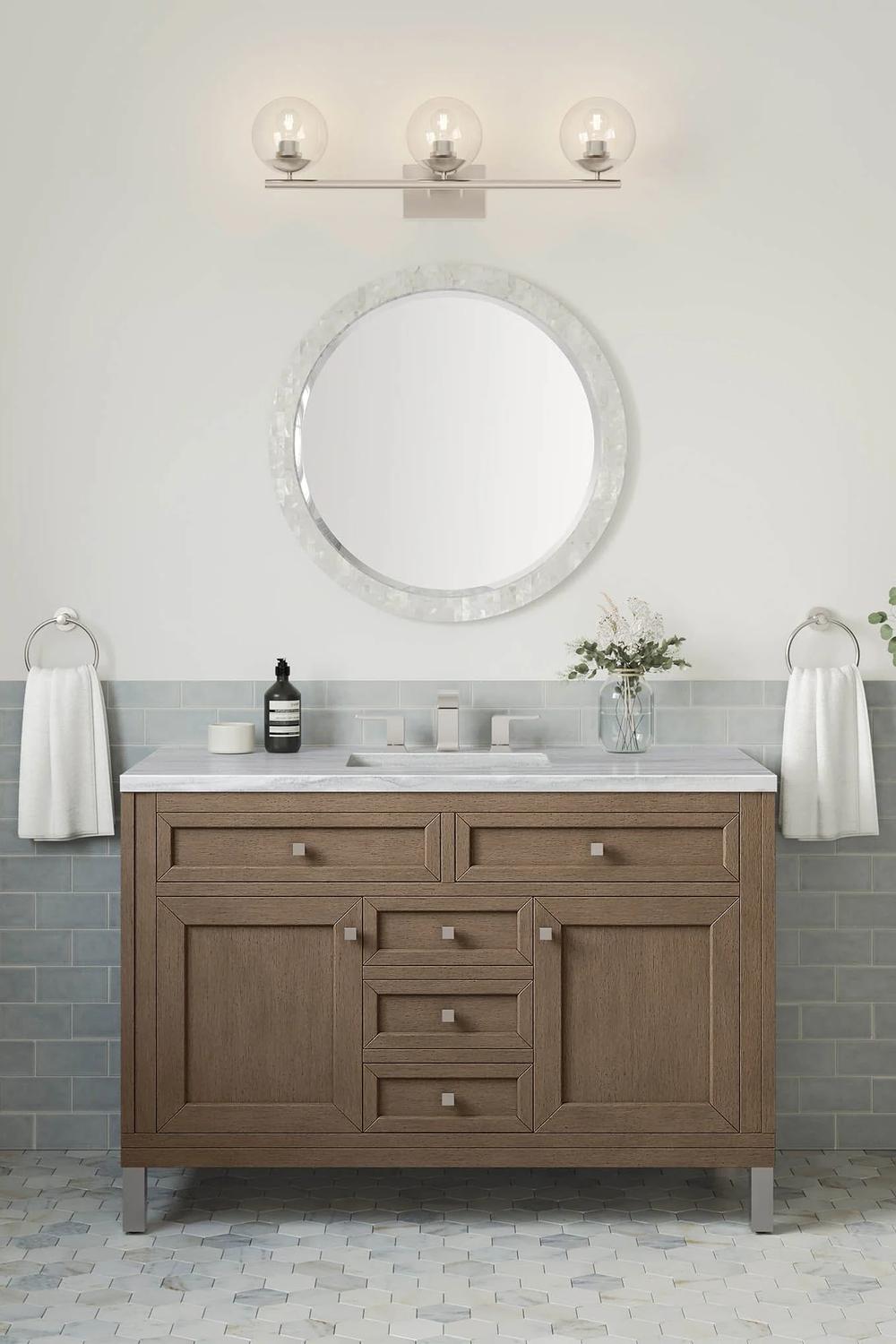 A stylish single bathroom vanity featuring intricate paneling and integrated rectangular sink.